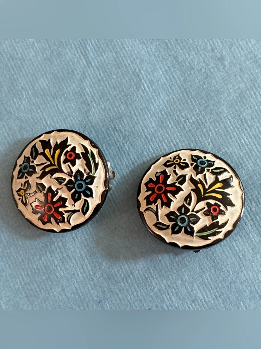 West Germany floral relief enameled bracelet and clip earrings set on beige